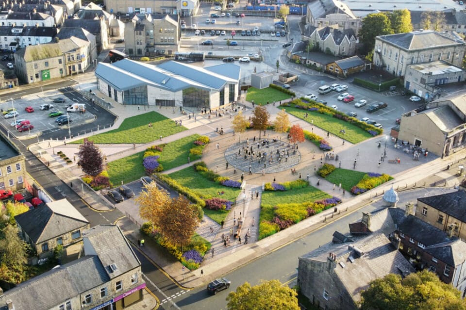 An aerial shot of Rawtenstall Bus Station and Rawtenstall town centre on a sunny day